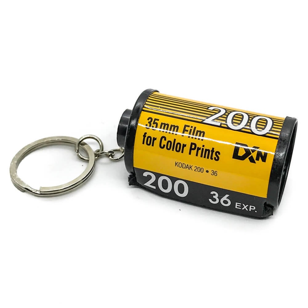 35mm yellow kodak film keychain on white background