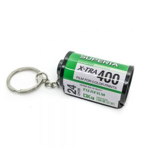 35mm green film keychain on white background fujifilm
